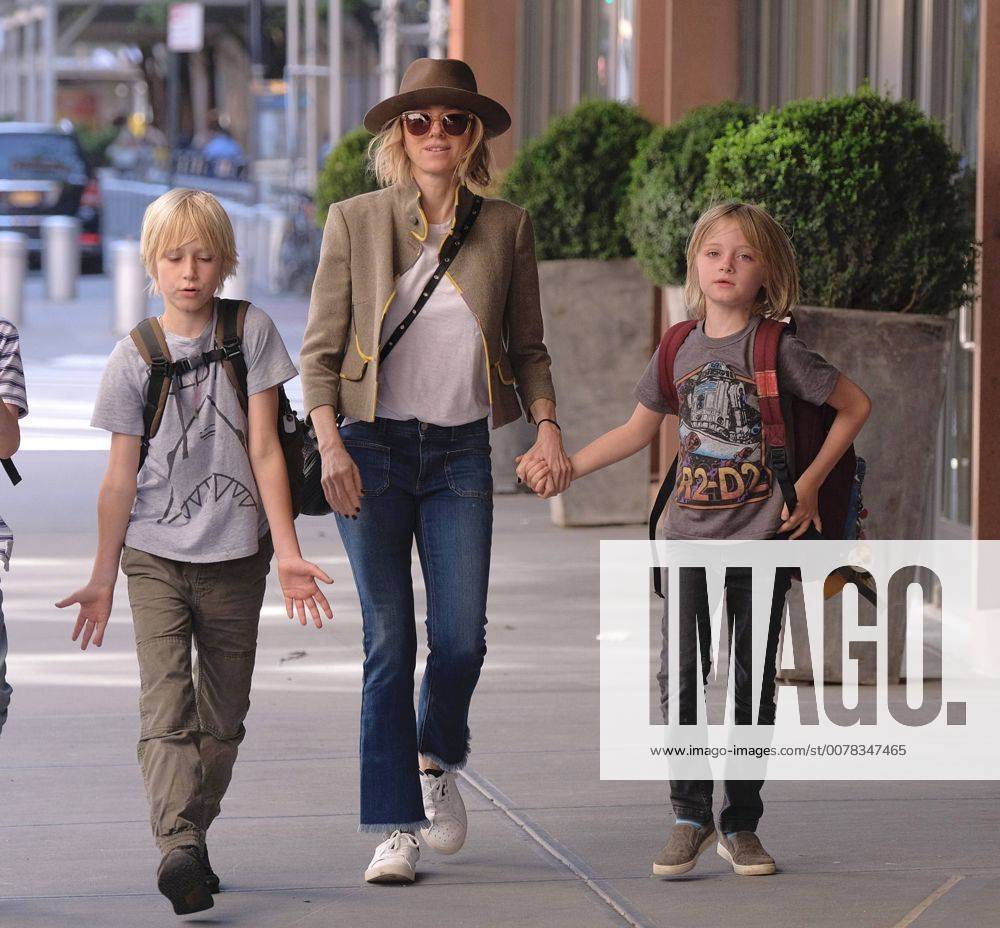 Actress Naomi Watts walks with her children Alexander Schreiber (L) and