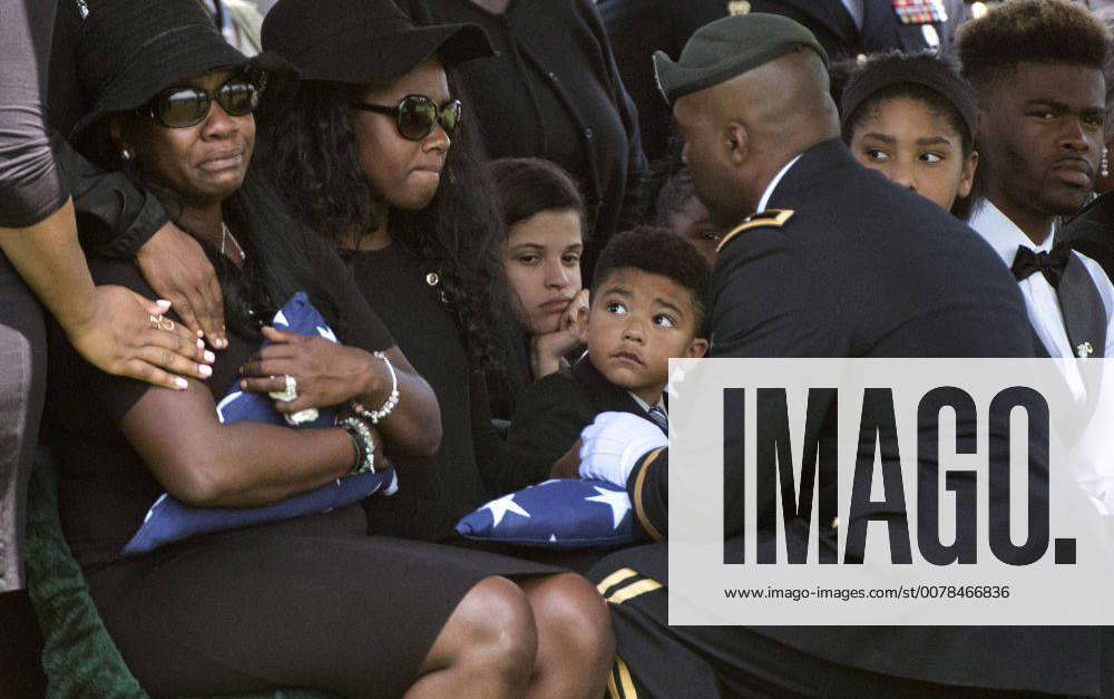 Brig. Gen. Antonio Fletcher presents a flag to the family of Army Staff ...