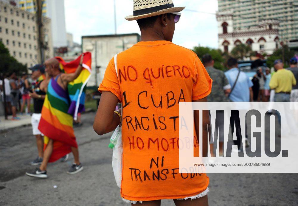 A man wears a tshirt that reads I don t want a racist, homofobic or