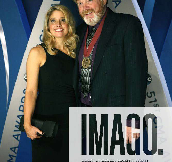 Mac McAnally and his wife Shawna walk the red carpet as they arrive for