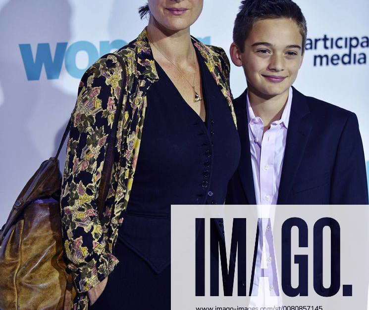 CarrieAnne Moss and her son Jaden Roy arrive for the premiere of