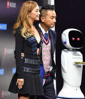 Hong Kong singer and actor Jordan Chan, right, and his actress wife ...