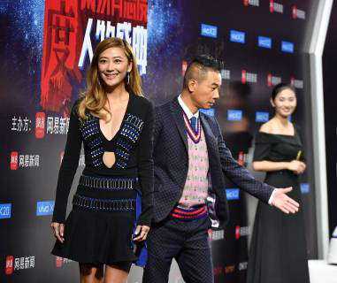 Hong Kong singer and actor Jordan Chan, right, and his actress wife ...