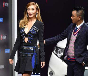 Hong Kong singer and actor Jordan Chan, right, and his actress wife ...