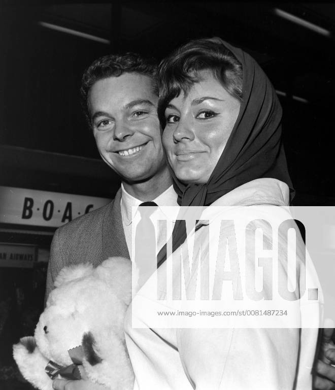 AMERICAN ACTOR RUSS TAMBLYN WITH WIFE AT LONDON AIRPORT ; 3 AUGUST