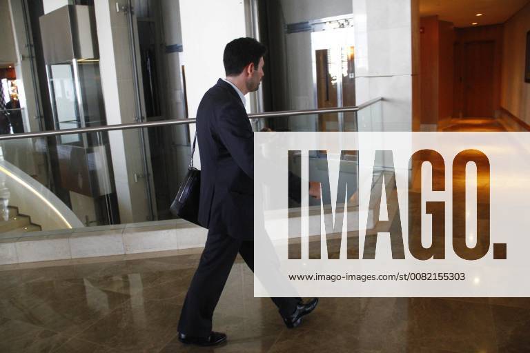 Cypriot businessman Orestes Fintiklis (C) before an operation at the