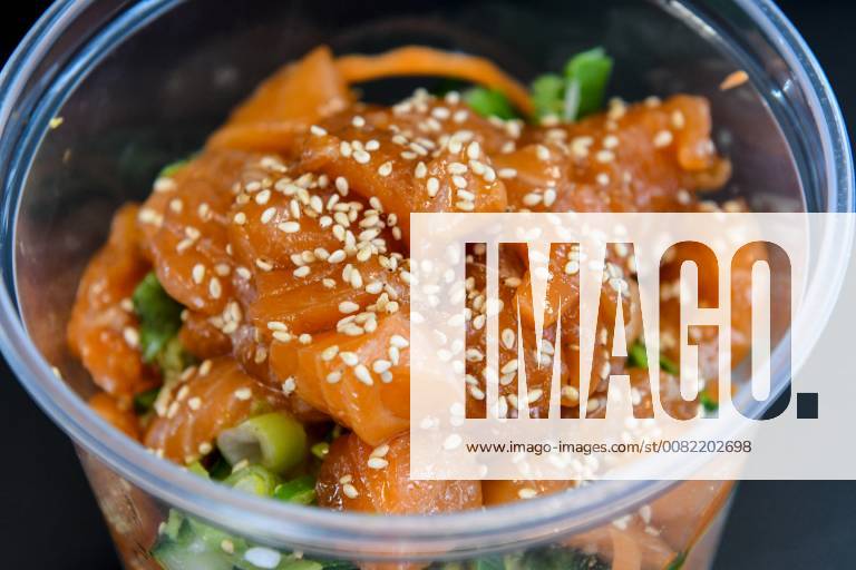 Raw salmon marinated and sprinkled with sesame seeds in a Japanese