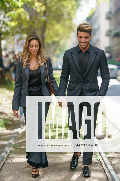 Eleonora Brunacci Di Vaio and Mariano Di Vaio walking outside of the Dolce  & Gabbana runway