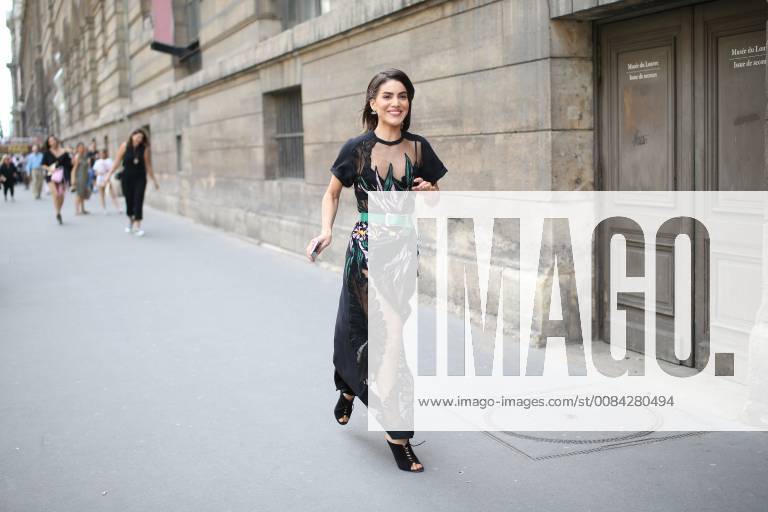 Blogger Camila Coelho attending the Elie Saab runway show during Haute