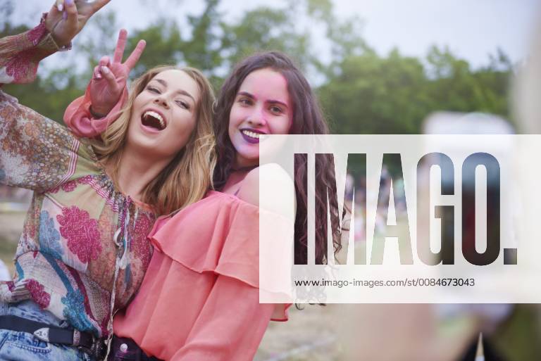 Portrait of happy women at the music festival, photographing model ...
