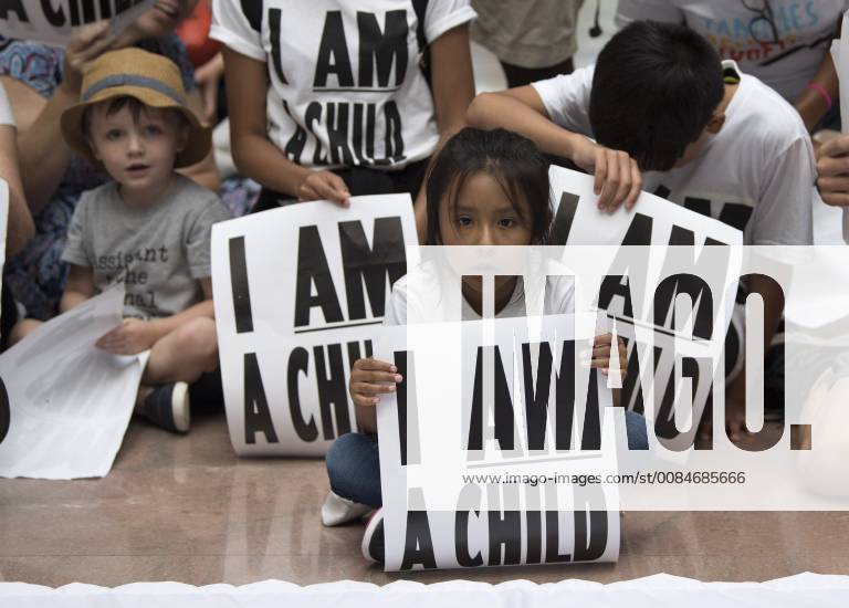 Children participate in a protest against child separation of illegal ...