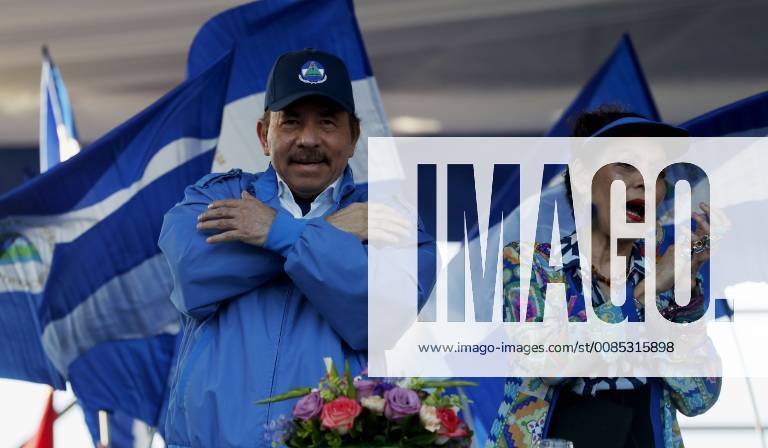 Nicaraguan President Daniel Ortega (L) speaks next to his wife and vice ...