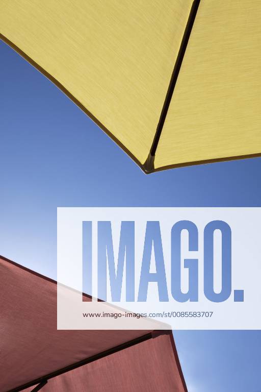 Two beach umbrellas, closeup, directly below Cary, North Carolina, USA Y