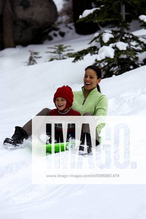 Cheryl Cannon and her son, Tucker, sledding at the snow park at Echo