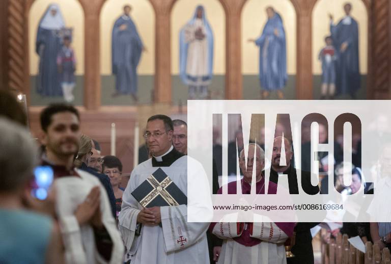 June 3, 2015 - U.S. - Father Adam Lee Ortega, left, and Archbishop ...