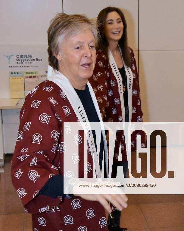 Sir Paul McCartney(L) and his wife Nancy Shevell arrive at Tokyo