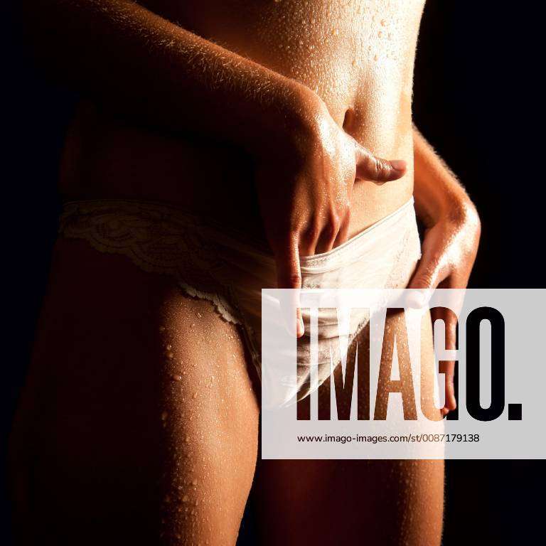 Wet body of a beautiful woman in white underwear model released Symbolfoto Y