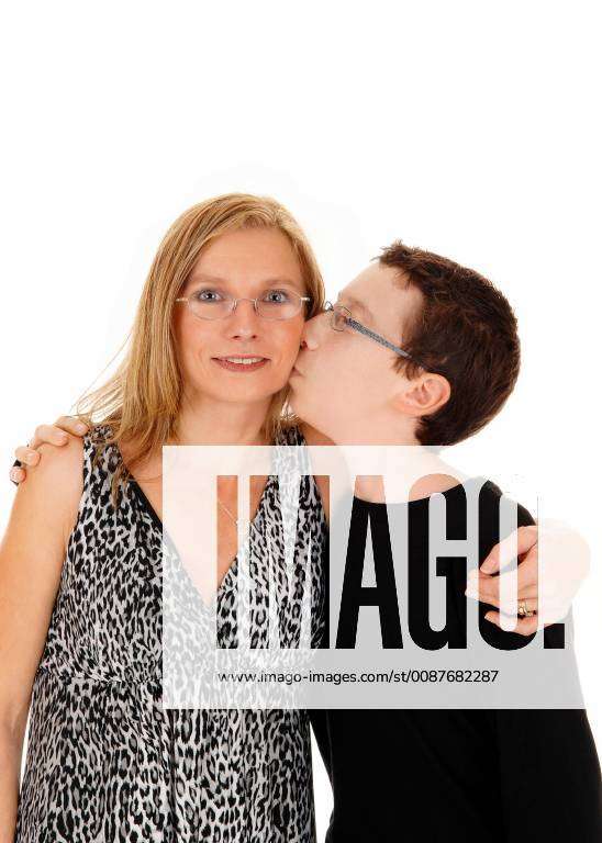 A young boy hugging and kissing his mom, isolated for white