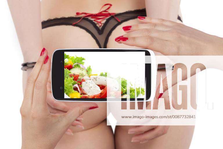 Hot sexy ass in panties and hands with handcuffs backview isolated on white  with smartphone screen