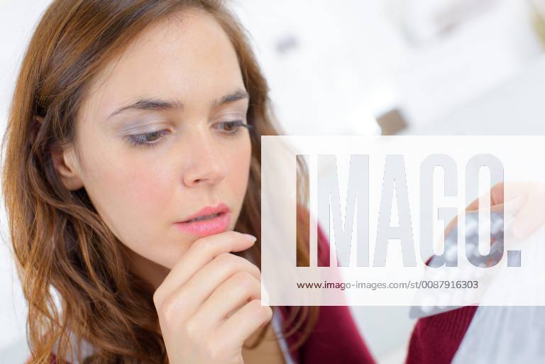 Worried woman holding pimms model released Symbolfoto Y