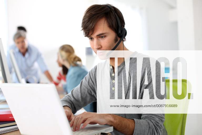 Student with headset on doing English language test model released