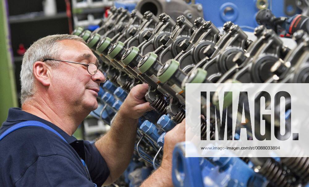 Assembly fitter Klaus Peter Voth assembles 11 rocker arms on a diesel