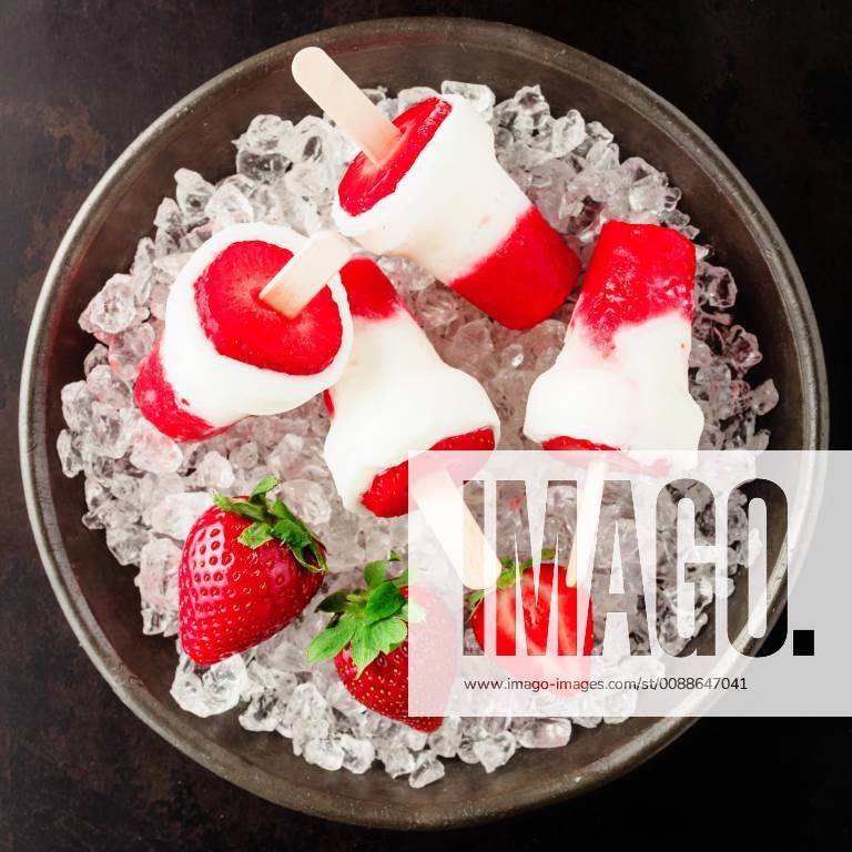 Healthy frozen strawberry dessert with the pulp of fresh ripe red