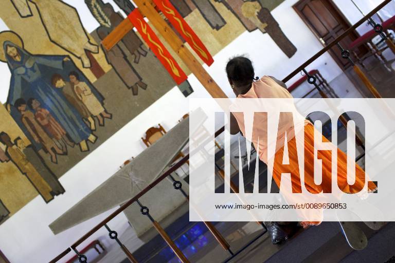 A praying chagossian refugee at the church, Baie du Tombeau, Mauritius