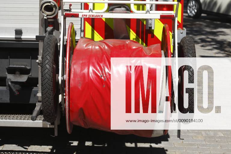 Rolled fire hose on a fire truck Bremen Germany Coiled fire hose at a