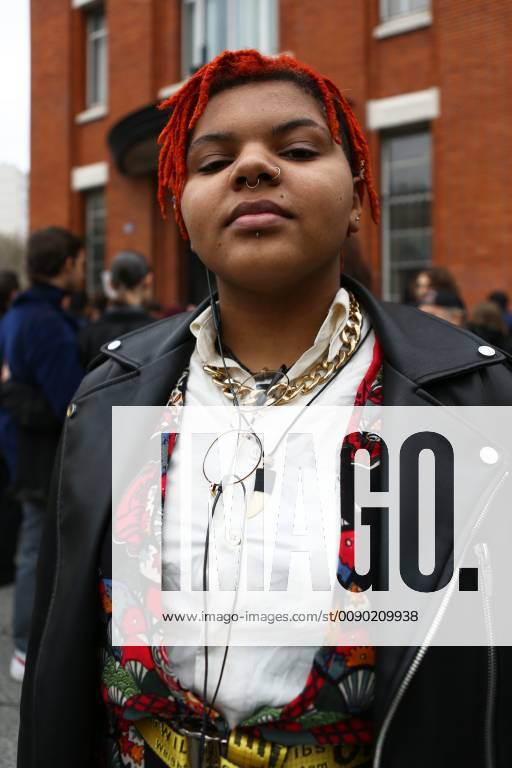 A chic showgoer attending the Nina Ricci show during Paris Fashion Week