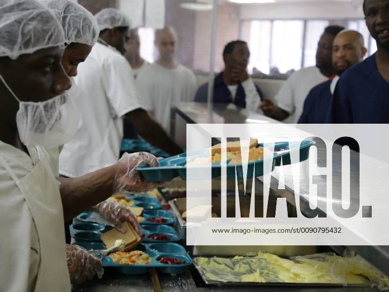 June 24, 2014 - Michigan, MI, U.S. - Inmates are served food through ...