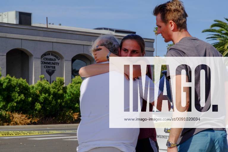 April 27, 2019 - People mourn by the Poway synagogue where a nineteen ...