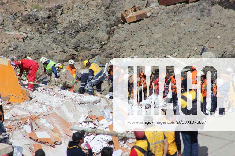 A view of a group of construction workers at the landslide area, in La ...