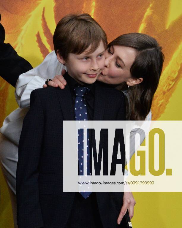 Cast member Vera Farmiga kisses her son Fynn Hawkey during the premiere ...