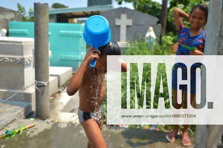 June 22, 2019 Manila, Philippines A young kid enjoys a cold shower