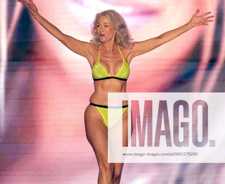 Sports Illustrated model Kathy Jacobs walks the runway during