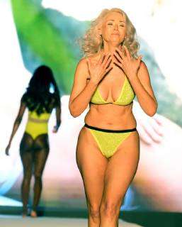 Sports Illustrated model Kathy Jacobs walks the runway during Miami Swim  Week at the W hotel