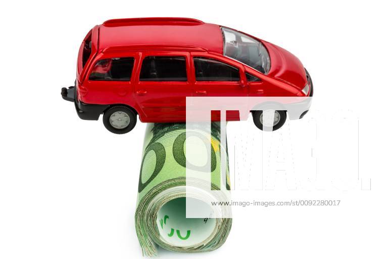 A car stands on euro banknotes Costs for car purchase, gasoline