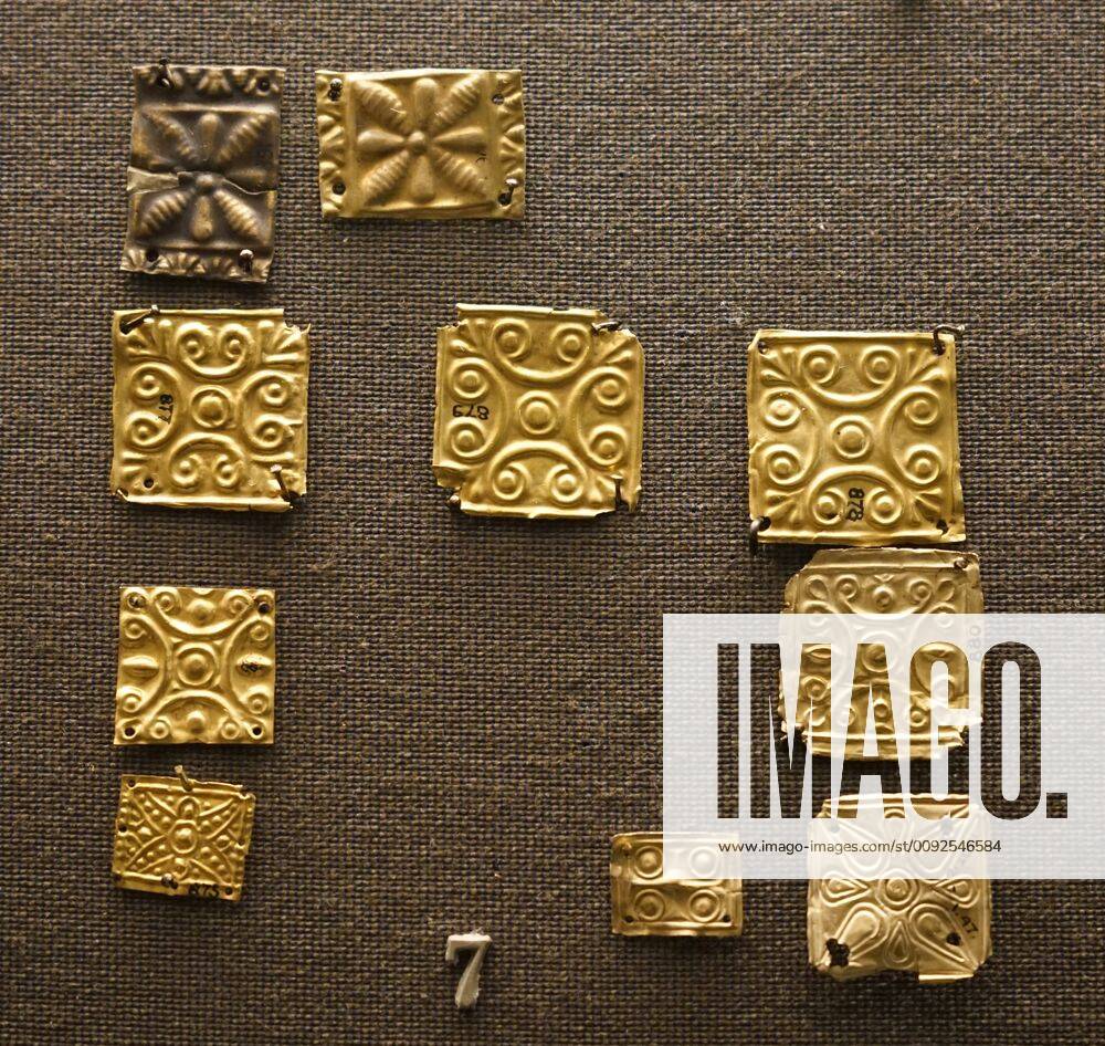 Embossed decorative gold tiles Embossed decorative gold tiles from ancient Greece. Y
