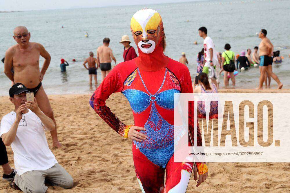 QINGDAO, CHINA - AUGUST 05: A model wearing facekini poses for a picture on  a beach on