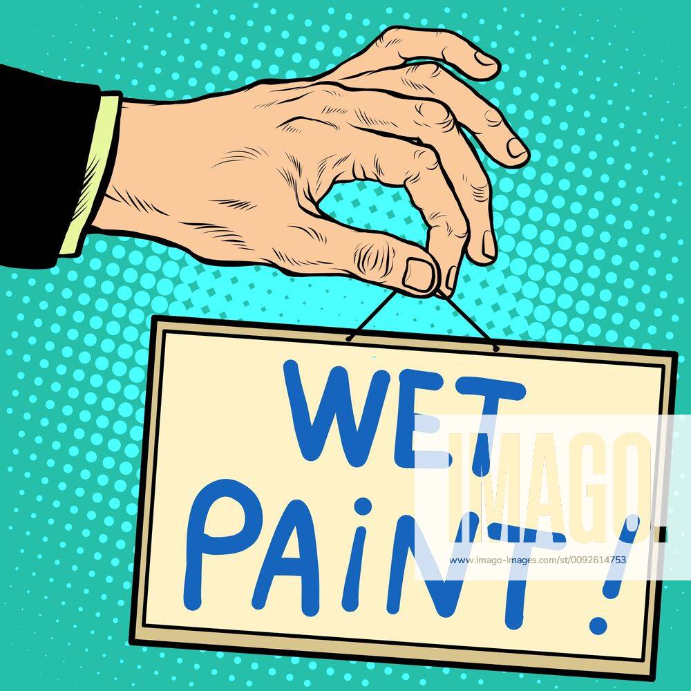 Hand holding a sign wet paint