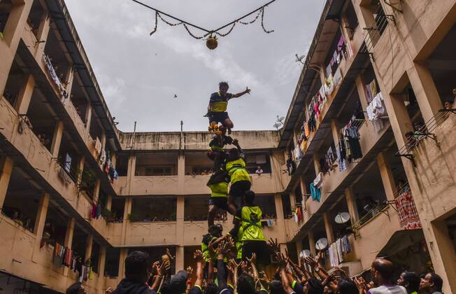 MUMBAI, INDIA - AUGUST 24: A Hindu devotee breaks a dahi-handi (curd ...