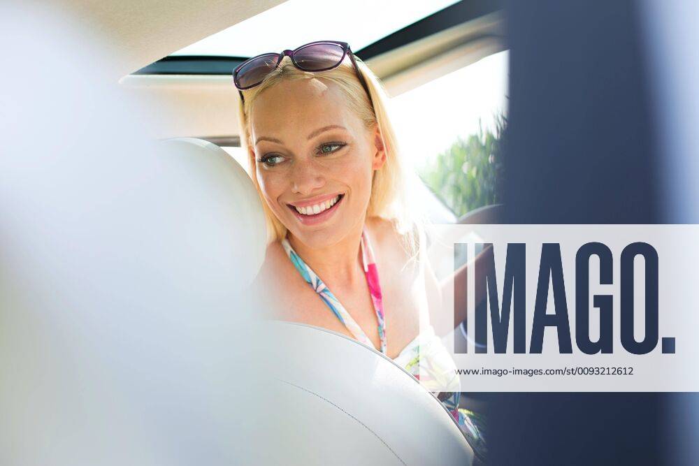 Happy Beautiful Woman Looking Back While Driving Car model Released happy-beautiful-woman-looking-back-while-driving-car-model-released