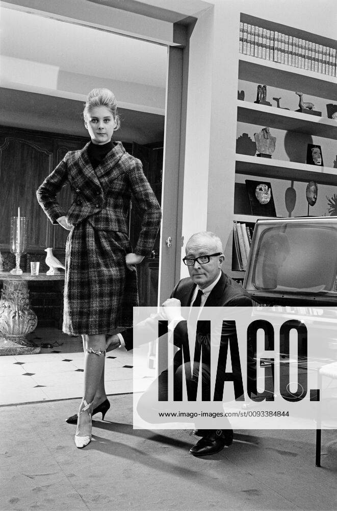 Roger Vivier, 1967 French stylist Roger Vivier at home (?) with a model ...