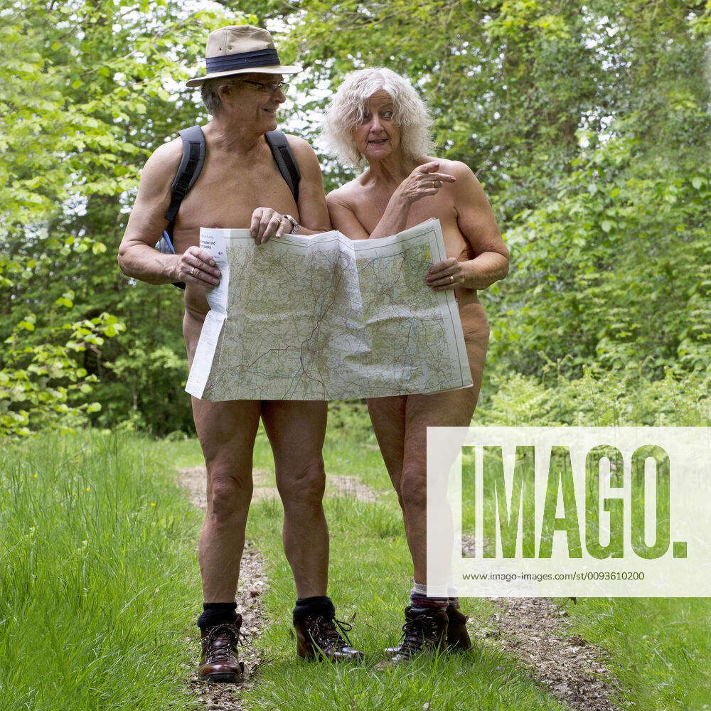 NUDE. older couple walking in the countryside