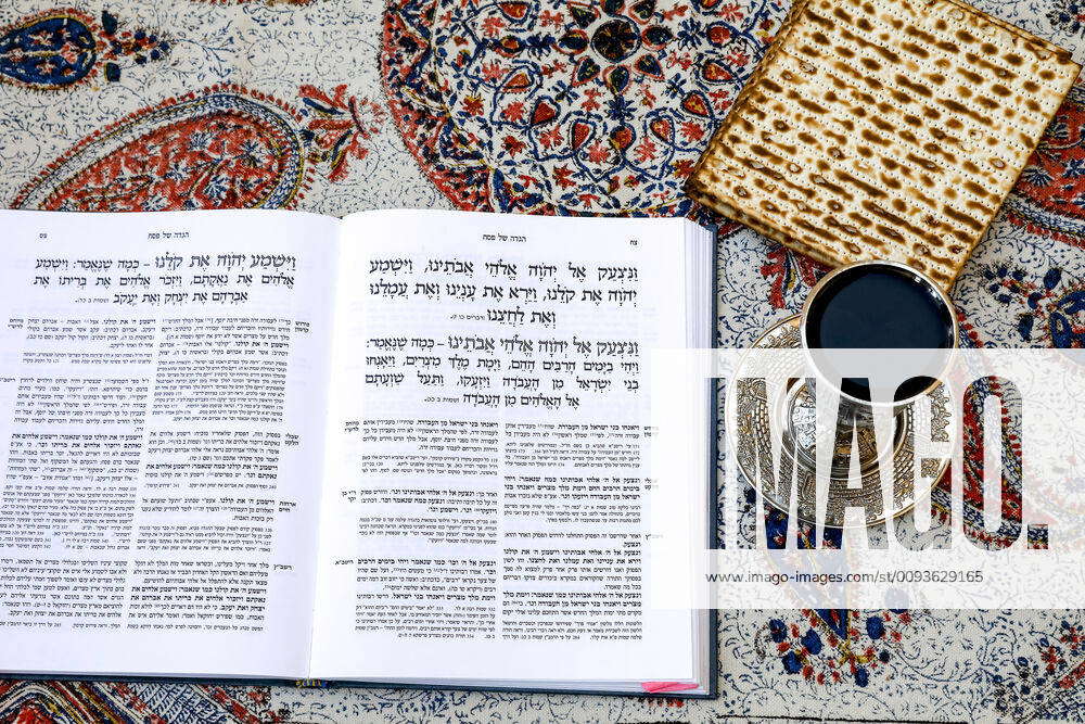 Passover Seder Haggadah in a Jerusalem jewish home, with wine and matsa