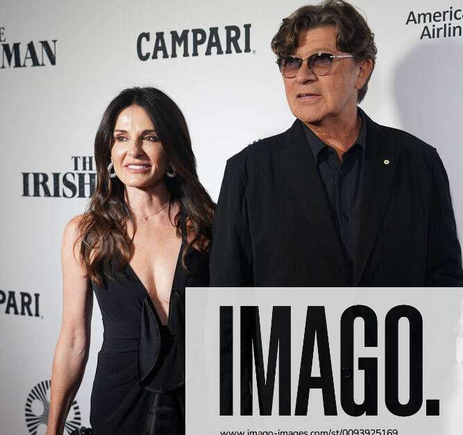 Robbie Robertson and Janet Zuccarini arrive on the red carpet at the ...