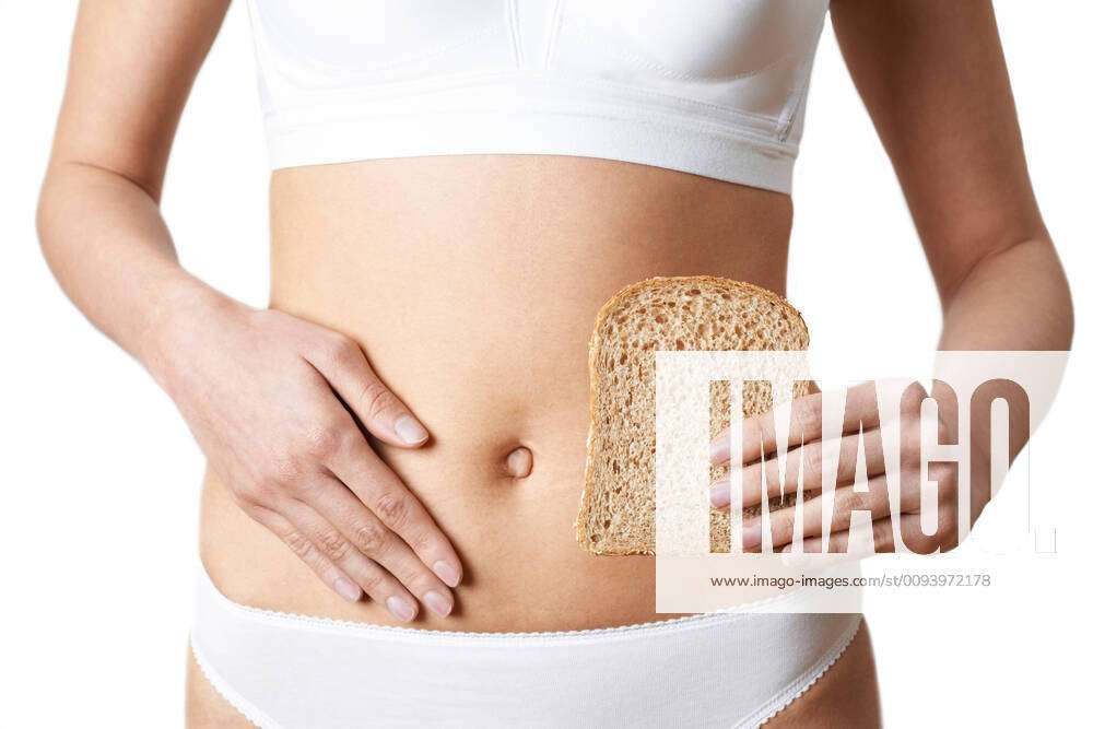 Close Up Of Woman Wearing Underwear Holding Slice Of Brown Bread And  Touching Stomach,model