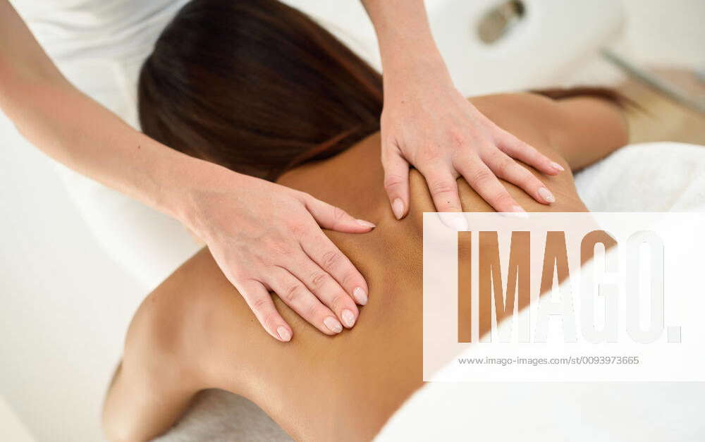 Middle-aged woman having a back massage in a beauty salon. 4675724