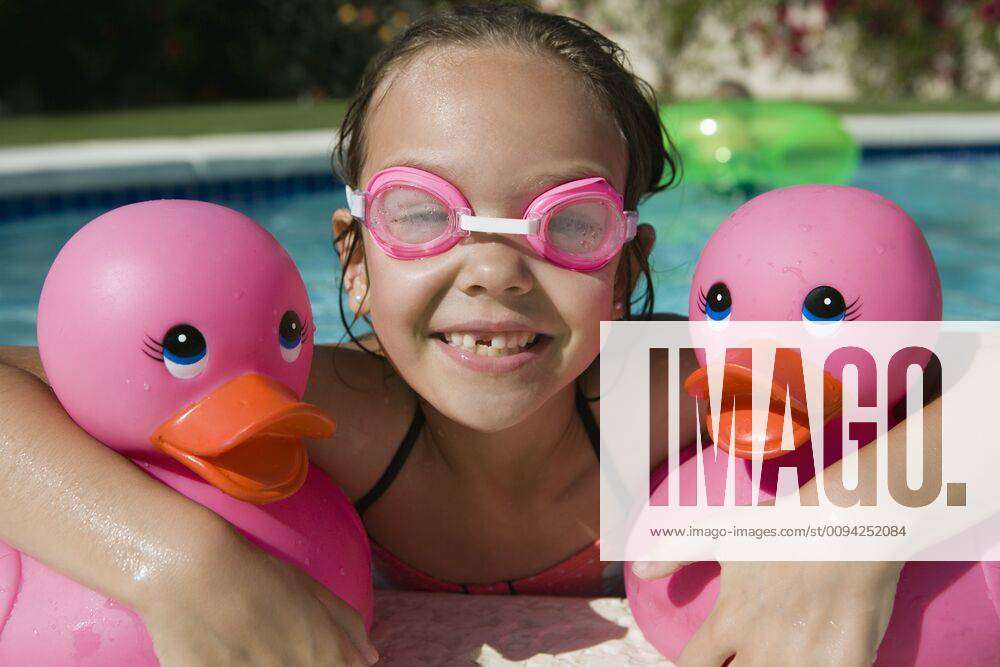 Girl At Pool Side Holding Pink Rubber Ducks Model Released Symbolfoto Property Released